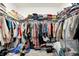 Walk-in closet with ample storage and organization, showcasing an extensive wardrobe collection, and various items at 2795 Lanai Ln, Greenwood, IN 46143