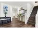 Welcoming foyer with hardwood floors, stairs, and stylish console table at 2795 Lanai Ln, Greenwood, IN 46143