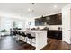 Stylish kitchen with dark cabinets, a large island, and counter seating at 2795 Lanai Ln, Greenwood, IN 46143