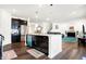 Open floor plan featuring a kitchen island, stainless appliances and an open living room and staircase at 2795 Lanai Ln, Greenwood, IN 46143