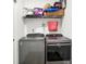 Functional laundry room with a side-by-side washer and dryer, and storage space, designed for convenience at 2795 Lanai Ln, Greenwood, IN 46143