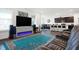 Open-plan living room and kitchen area with modern finishes and stainless steel appliances at 2795 Lanai Ln, Greenwood, IN 46143
