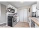 Well-equipped kitchen featuring a stainless steel range, microwave, and dishwasher, complemented by wood countertops at 300 Indiana Ave, Pendleton, IN 46064
