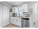 Modern kitchen with white cabinets, stainless steel dishwasher and a hardwood countertop providing a clean aesthetic at 300 Indiana Ave, Pendleton, IN 46064