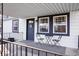Charming covered porch area with seating, perfect for enjoying the outdoors and relaxing at home at 300 Indiana Ave, Pendleton, IN 46064