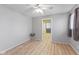 Simple bedroom featuring hardwood floors, neutral walls, and natural light, offering a peaceful retreat at 3109 Welch Dr, Indianapolis, IN 46224