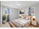 Comfortable bedroom with a Queen-sized bed, soft lighting, and modern decor at 3109 Welch Dr, Indianapolis, IN 46224