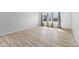 Spacious room with hardwood floors, large windows, and neutral paint, offering a blank canvas for personalization at 3109 Welch Dr, Indianapolis, IN 46224