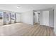 Minimalist living room featuring hardwood floors, neutral walls, and large windows, creating a bright and airy space at 3109 Welch Dr, Indianapolis, IN 46224
