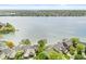 Scenic aerial view of lakefront homes, docks and lush trees in a serene waterside community at 3539 Clearwater Cir, Indianapolis, IN 46240