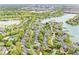 Serene aerial perspective of a lakeside community with numerous homes and tranquil waters at 3539 Clearwater Cir, Indianapolis, IN 46240