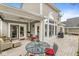 A covered back porch offers an outdoor space with comfortable seating and a ceiling fan at 3539 Clearwater Cir, Indianapolis, IN 46240
