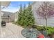 A cozy back deck is lined with mature trees and landscaping offering a private outdoor retreat at 3539 Clearwater Cir, Indianapolis, IN 46240