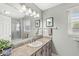 Bathroom with a large mirror, granite countertops, and a glass-enclosed shower at 3539 Clearwater Cir, Indianapolis, IN 46240