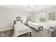 Bedroom with twin beds, natural light from the window, and comfortable furnishings at 3539 Clearwater Cir, Indianapolis, IN 46240