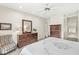 Spacious bedroom featuring a large dresser, ceiling fan, and neutral colors at 3539 Clearwater Cir, Indianapolis, IN 46240