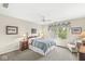 Bedroom with a ceiling fan, window, and comfortable furnishings at 3539 Clearwater Cir, Indianapolis, IN 46240