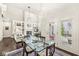 Dining area with hardwood floors, large table, leads into a living room with a fireplace and built-ins at 3539 Clearwater Cir, Indianapolis, IN 46240
