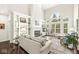 Inviting living room featuring a cozy fireplace, built-in shelving, and large windows for natural light at 3539 Clearwater Cir, Indianapolis, IN 46240
