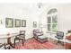 Bright sitting room with a chair, ottoman, and ample natural light from the large window at 3539 Clearwater Cir, Indianapolis, IN 46240