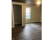 Bedroom view featuring wood-look flooring and a closet at 354 Bloomingdale Rd, Montezuma, IN 47862