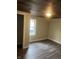 Bedroom featuring wood-look flooring, a closet, and fresh paint at 354 Bloomingdale Rd, Montezuma, IN 47862