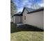 Exterior view of a home showing neutral siding, a dark metal roof and rain gutters at 354 Bloomingdale Rd, Montezuma, IN 47862