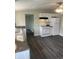 Modern kitchen featuring white cabinets, neutral countertop, and vinyl flooring at 354 Bloomingdale Rd, Montezuma, IN 47862