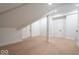 Finished attic space highlighting the hardwood floors and dormer windows at 395 Breakwater Dr, Fishers, IN 46037