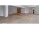 Large, open basement space with light hardwood flooring and neutral walls at 395 Breakwater Dr, Fishers, IN 46037