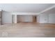 The spacious basement is equipped with light hardwood floors, recessed lighting and an open floor plan at 395 Breakwater Dr, Fishers, IN 46037