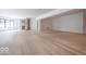 The large space has hardwood floors, a corner fireplace, recessed lighting, and lots of room at 395 Breakwater Dr, Fishers, IN 46037