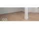 Finished basement space showing neutral walls and hardwood floors at 395 Breakwater Dr, Fishers, IN 46037