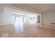The large basement is well-lit with hardwood floors, a stone fireplace, and ample natural light at 395 Breakwater Dr, Fishers, IN 46037