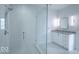 Bathroom featuring a glass shower, modern vanity, and stylish fixtures at 395 Breakwater Dr, Fishers, IN 46037