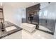 Luxurious bathroom featuring a freestanding tub, a sleek vanity with sink, and a glass-enclosed shower with black tile at 395 Breakwater Dr, Fishers, IN 46037