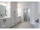 Contemporary bathroom with dual sinks and a glass-enclosed shower at 395 Breakwater Dr, Fishers, IN 46037