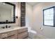 Modern bathroom featuring a custom vanity with stylish fixtures and black framed mirror at 395 Breakwater Dr, Fishers, IN 46037
