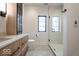 Bathroom featuring under sink storage, glass shower, and modern black hardware at 395 Breakwater Dr, Fishers, IN 46037