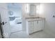 Bathroom featuring a sleek vanity, modern lighting, and an open doorway to the bedroom at 395 Breakwater Dr, Fishers, IN 46037