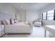 Bedroom with decorative wall trim, a comfortable chaise lounge, and a large window at 395 Breakwater Dr, Fishers, IN 46037