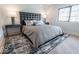 Stylish bedroom with modern decor, including a tufted headboard and sleek side tables at 395 Breakwater Dr, Fishers, IN 46037