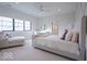 Bright bedroom with large windows, a chaise lounge, and stylish decorative accents at 395 Breakwater Dr, Fishers, IN 46037