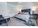 Comfortable bedroom with a chair, stylish rug, and sleek side tables at 395 Breakwater Dr, Fishers, IN 46037