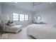Inviting bedroom with large window, carpet floors, and a comfortable chaise lounge at 395 Breakwater Dr, Fishers, IN 46037
