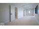Large bedroom with plush carpeting, recessed lighting, and access to a bathroom with a glass shower at 395 Breakwater Dr, Fishers, IN 46037