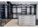 Large walk-in closet with glass doors, custom shelving, and a center island, perfect for organization at 395 Breakwater Dr, Fishers, IN 46037