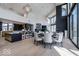 Open-concept dining and kitchen area with hardwood floors and modern lighting at 395 Breakwater Dr, Fishers, IN 46037