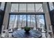 Bright dining room featuring a round table, floor-to-ceiling windows, and serene wooded views at 395 Breakwater Dr, Fishers, IN 46037