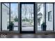Inviting entryway with modern door and expansive windows offering ample natural light at 395 Breakwater Dr, Fishers, IN 46037